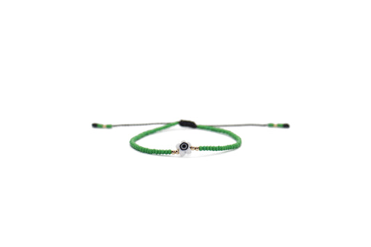 Pulsera verde con ojo turco flor blanco