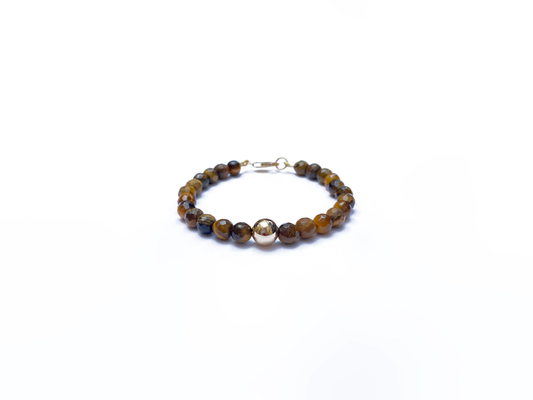 Pulsera ojo de tigre con esfera de oro